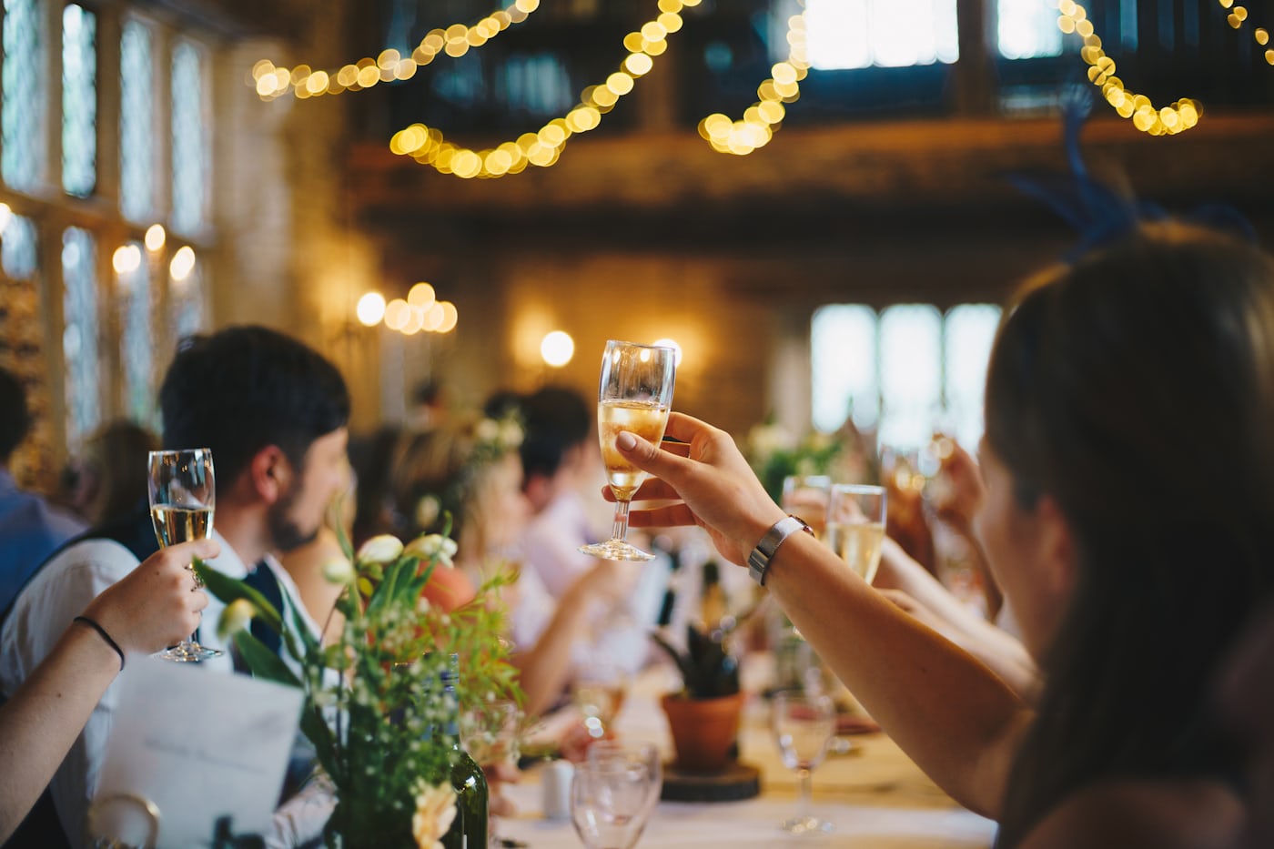 Guests raising glasses at an opening