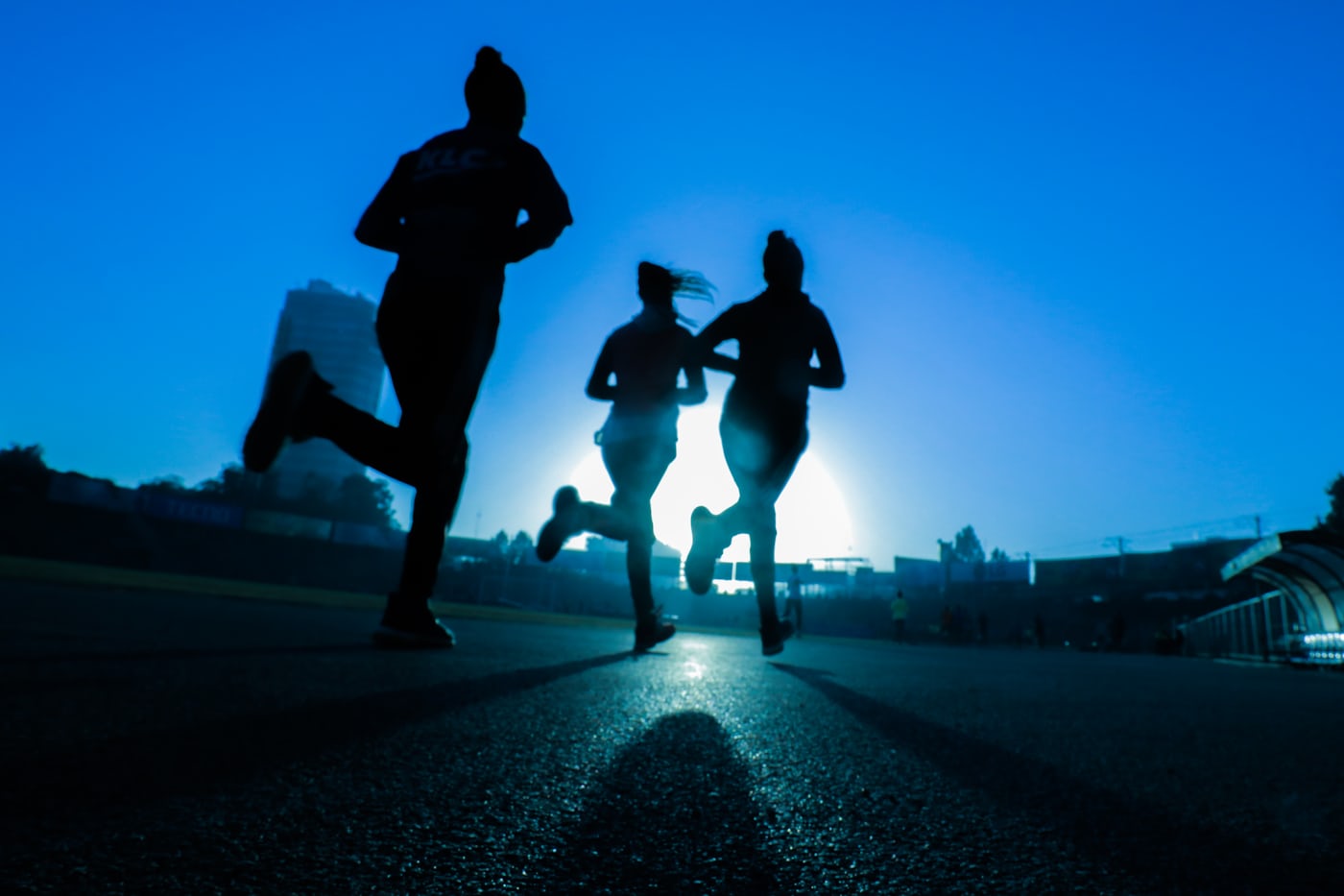 Runners at dawn during a Kestrel Athletic community run