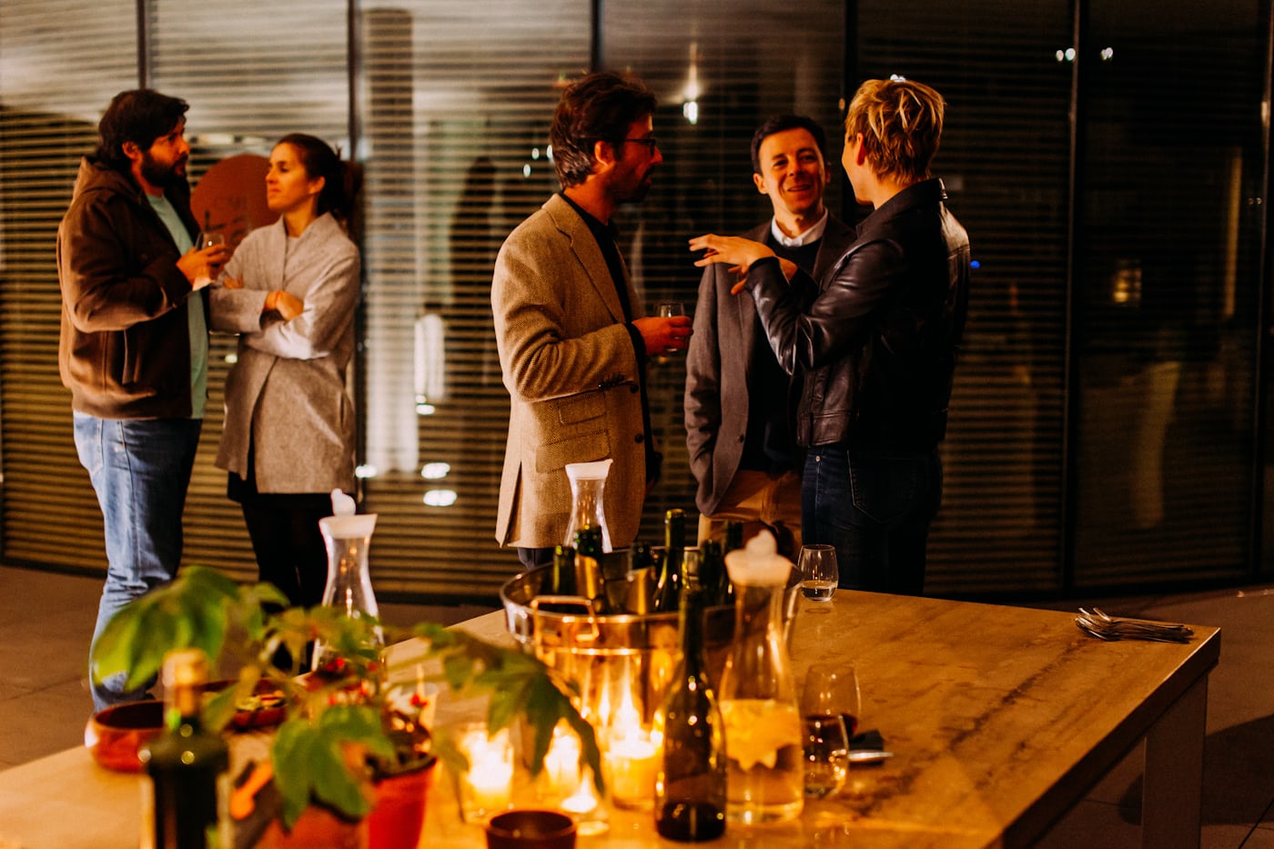 People talking at a sampling stand